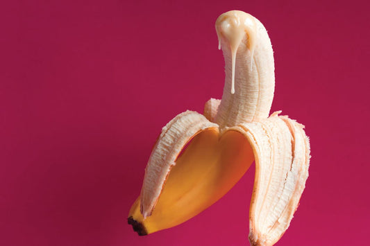 Banana with cream on tip simulating cum