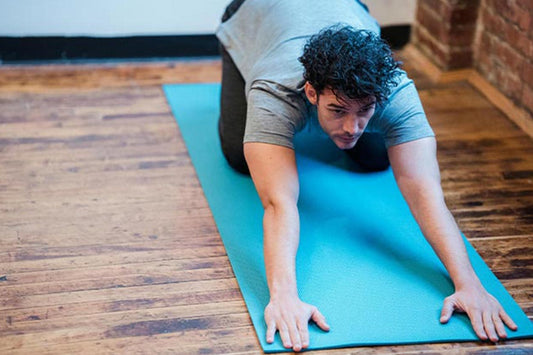 man practicing sexercise through yoga