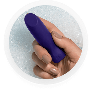 Woman's hand holding a Promescent bullet vibrator