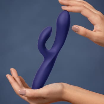 Woman's hands holding a Promescent brand adult sex toy