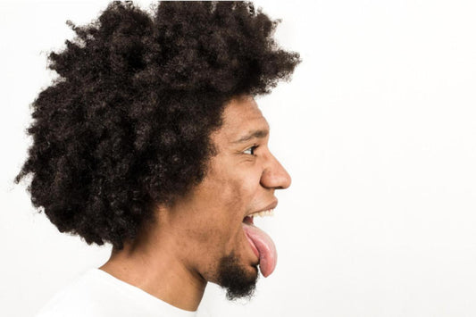 Man with his tongue out symbolizing cunnilingus tips and techniques for men