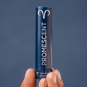 Bottle of Promescent Delay Spray for men in a person hand